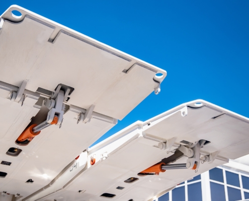 Aircraft Wing Flaps Detail Against Bright Blue Sky
