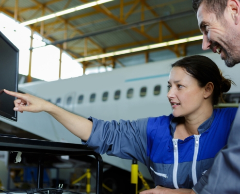 Engineers Lookinga T Computer