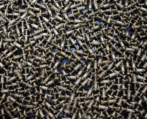 Top Down View Of Pile Of Aerospace Hardware Spring Screws