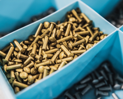 Bunch Of Golden And Silver Aircraft Rivets Used To Repair Aircraft