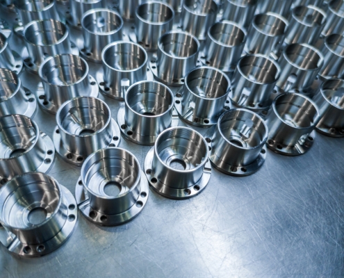 Shiny Metal Aerospace Parts After Cnc Machining On Steel Surface With Selective Focus, Industrial Background