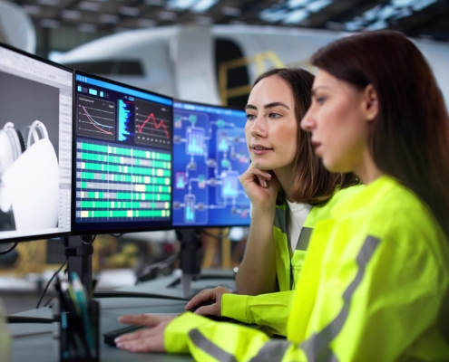 Skilled Technician Repairing Aircraft Engine In Hangar