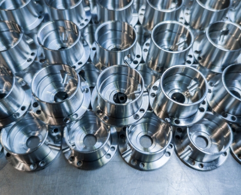 A Batch Of Shiny Aluminium Aerospace Parts Made With Cnc Machine