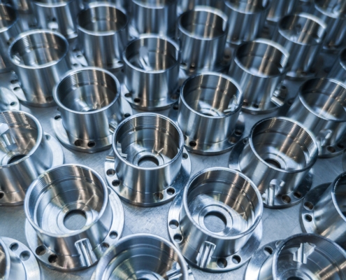A Batch Of Shiny Metal Cnc Aerospace Parts Production Close Up With Selective Focus For Industrial Background